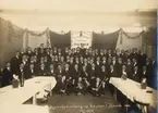 Svenska Eldareunionens 10 årsfest i Malmö 12 januari 1924, gruppfoto, musiker,  fiol och dragspel i främre raden, centralateliern Malmö.