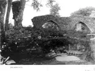 Kyrkan. Långhusets, portalbasen in situ. Foto mot nordost.