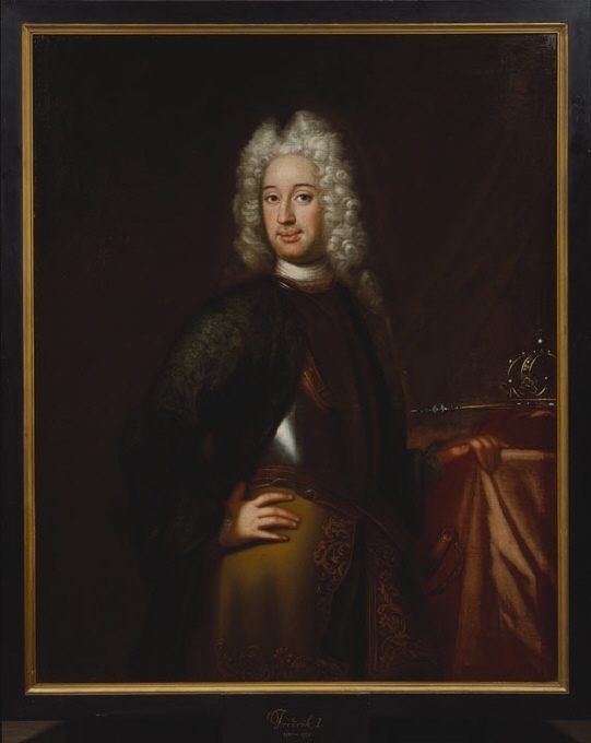 I förgrunden till höger en dunge med lövträd, i mellanplanet ruiner, till vänster en trädbevuxen höjd. På en väg framför ruinerna går en kvinna med två barn*. I bakgrunden sjö och förtonande höjder. Blå himmel med moln i grått och gult, något rodnande åt vänster.