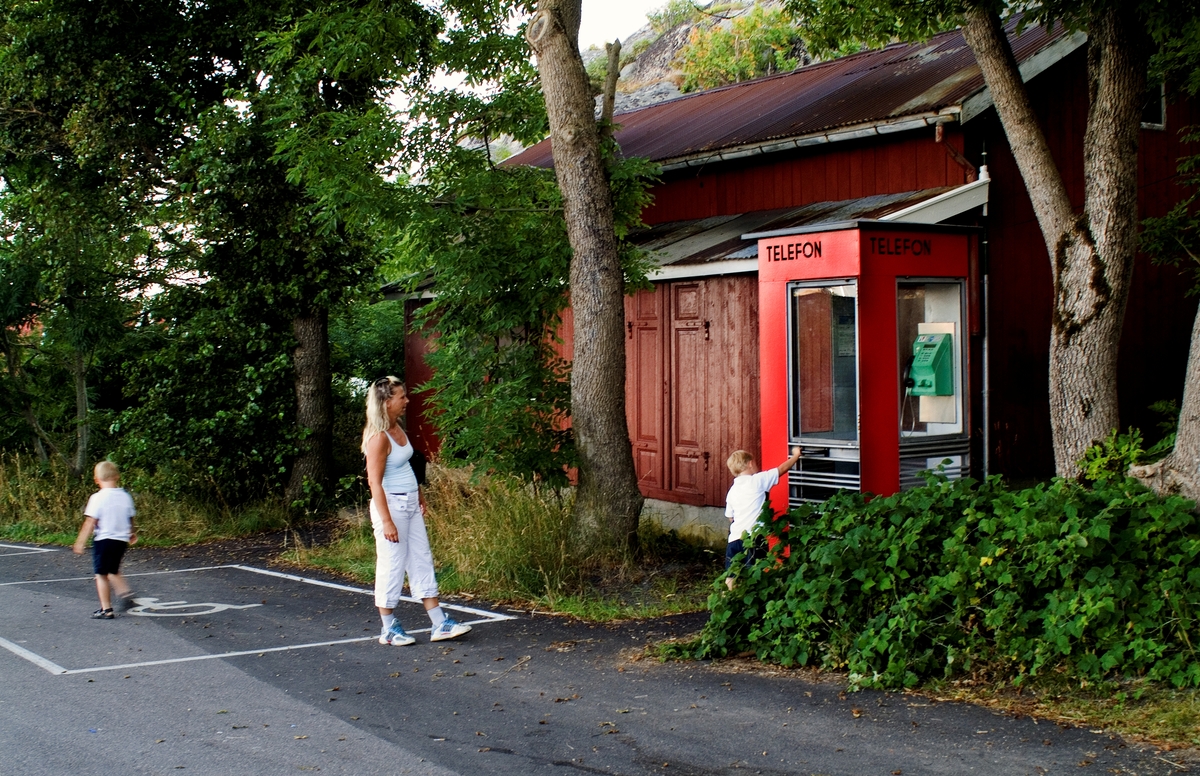 This is the story of how Norway’s most important conversation-space was designed by a young, freshly graduated man from Bergen.

“Norwegian architects are hereby invited…”
In the autumn of 1932, Oslo Telefonanlegginitiated an architectural competition. Finally, Oslo would get its own telephone booth. The city had had so called “talking-stations” from 1885, which in turn were overtaken by automatic telephones 
 only available at selected Narvesen kiosks. The state 
was of the opinion that now was the time to offer the public a better service; public telephone booths open 24/7, like the ones they already had in Sweden and England. But what would they look like, these new telephone booths? What considerations would it
 be necessary to take when designing it? The telegraph board developed a detailed list of demands and restraints: “The booth is intended to be placed outside on the streets and squares and need to be designed so that snow and ice does not hinder the opening and closing of the doors,” they wrote. “To prevent vandalism, theft, uncleanliness etc. inside the booth, it needs to be designed so that from all angles one may see what is going on in there.” Additionally, it would need to withstand storms and bad weather, and “preferably also being whipped by rain mixed with seawater” 

This was not all: The appearance would have to be «pleasing». The booth also needed to be movable, so that it could be taken in to be serviced at Telegrafverket’s main workshops. The reqired material was iron, and the surface was to be spray painted  preferably using car-body paint. There was a requirement for “a writing shelf, a pack shelf, and a suitable place for the telephone catalogue.” Also, there would need to be an illuminated TELEFON  sign, easily visible from all four angles. The total cost for each booth should not exceed 1000 kroner. The first prize for coming up with such a product was 800 kroner.

“Norwegianarchitects are hereby invited to partake in a competition for the design of a telephone booth…”  

The man with the solution
«At some point in 1932, Georg Fredrik sat at a party in Bergen. Maybe he felt a bit lost and forgotten as he often had throughout his life. He retreated to a quiet corner, took out a pencil and strted doodling on a matchbox.  According to my mother, this was how the telephone booth came into being.” In the book “Norges lille røde  historien om telefonkiosken,” Lars Fasting describes his father, the man who is far less known than the iconic architctural structure he left behind. Georg Fredrik Fasting was from Bergen, born into a family of working people and smallholders. One unusual facet of Georg Fredrik was that he was born without ears. His mother made sure he learnt to speak, read and write, 
ut Lars Fasting indicates that his father would seek refuge in drawing when the social challenges became too much to bear. And in the end drawing became his profession. In 1924 he secured a guarantor for a student loan, and started studying to become an a
rchitect at the NTH. Throughout the 1930s he entered several architectural competitions, with drafts produced, according to his son, “after work and in the late hours of the night.”

His efforts were not wasted. Out of 93 entries, with names such as “Flirt”, “Brrr”, “Ring” and “Amor”, the jury selected Fasting’s submission, “RIKS” as the new telephone booth: “The draft shows a strikingly simple solution to the task, technically as well as aesthetically well worked out.”

Taut and provident
Simple and aesthetc are the keywords here. Fasting had designed a booth pointing towards the future, and to modernism. Just how modern it was can be seen by comparing RIKS to the British telephone booth, also designed in the interwar-era. While the British version with it classicistic style is looking back to the heyday of the empire, Fasting’s booth is progressive and functionalistic. Like most Norwegian architects, Fasting broke with the classicistic style of architecture after the Stockholm-exhibition in 1930. “After it, almost all buildings erected in Norway until the German invasion in 1940, were in the functionalistic architectural style,” writes senior curator of architecture at the Norwegian National Museum, Ulf Grønvold, in the book, “Den lille røde”.“TheNorwegian booth is a piece of functionalistic architecture, an asymmetric composition with its roof slab overhanging the word TELEFON, in bold sans seraph lettering,”concludes Ulf Grønvold.

Fashionably red
And it was red. Fasting chose a colour which was part of the modern palette. “A bright red colour, but not as shiny as a signal red, the character of the colour places it among the fashionable colours within functionalism,” states paintings conservator and researcher in NIKU (Norwegian Institute for Cultural Heitage Research), Jon Brænne. In his opinion, Fasting went for visibility without making the booth stand out too much from its surroundings. The original colour was in use up to around 1950, when it changed to signal red. Towards the end of the 1970s the clour was again adjusted towards today’s orangey red.

The design, however, has not changed. RIKS is eighty years and still looks remarkably good. That’s what makes Fasting’s telephone booth a classic  even before it was added to DOCOMOMO’s list over moden icons of design. For Telenor, the telephone booth has served as a pathway into the hearts of the public. For many, Telenor (Televerket) was synonymous with exactly this telephone booth, because this was where one would go to place a call. Having a home
phone was not common until the 1980s. As such the red box became part of the Norwegian everyday and consciousness. The symbol- and publicity value of this is hard to evaluate, but in 2007 it was time to give honour where honour was due, Telenor, in consul
tation with the Directorate for Cultural Heritage, decided to preserve 100 telephone booths for all eternity.

And what about Georg Fredrik Fasting? What happened to him? At the age of 56 an entry in his diary states: «I CAN HEAR». As the first person in th world he had undergone an operation where he had ear canals constructed and eardrums fitted. For the rest of his life, the man behind Norway’s own telephone booth could answer the telephone himself.

Source: Norges lille røde historien om telefonkiosken (2007), issued by The Norwegian Telecom Museum and Telenor Cultural Heritage.