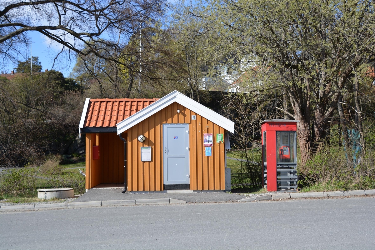 This is the story of how Norway’s most important conversation-space was designed by a young, freshly graduated man from Bergen.

“Norwegian architects are hereby invited…”
In the autumn of 1932, Oslo Telefonanlegginitiated an architectural competition. Finally, Oslo would get its own telephone booth. The city had had so called “talking-stations” from 1885, which in turn were overtaken by automatic telephones 
 only available at selected Narvesen kiosks. The state 
was of the opinion that now was the time to offer the public a better service; public telephone booths open 24/7, like the ones they already had in Sweden and England. But what would they look like, these new telephone booths? What considerations would it
 be necessary to take when designing it? The telegraph board developed a detailed list of demands and restraints: “The booth is intended to be placed outside on the streets and squares and need to be designed so that snow and ice does not hinder the opening and closing of the doors,” they wrote. “To prevent vandalism, theft, uncleanliness etc. inside the booth, it needs to be designed so that from all angles one may see what is going on in there.” Additionally, it would need to withstand storms and bad weather, and “preferably also being whipped by rain mixed with seawater” 

This was not all: The appearance would have to be «pleasing». The booth also needed to be movable, so that it could be taken in to be serviced at Telegrafverket’s main workshops. The reqired material was iron, and the surface was to be spray painted  preferably using car-body paint. There was a requirement for “a writing shelf, a pack shelf, and a suitable place for the telephone catalogue.” Also, there would need to be an illuminated TELEFON  sign, easily visible from all four angles. The total cost for each booth should not exceed 1000 kroner. The first prize for coming up with such a product was 800 kroner.

“Norwegianarchitects are hereby invited to partake in a competition for the design of a telephone booth…”  

The man with the solution
«At some point in 1932, Georg Fredrik sat at a party in Bergen. Maybe he felt a bit lost and forgotten as he often had throughout his life. He retreated to a quiet corner, took out a pencil and strted doodling on a matchbox.  According to my mother, this was how the telephone booth came into being.” In the book “Norges lille røde  historien om telefonkiosken,” Lars Fasting describes his father, the man who is far less known than the iconic architctural structure he left behind. Georg Fredrik Fasting was from Bergen, born into a family of working people and smallholders. One unusual facet of Georg Fredrik was that he was born without ears. His mother made sure he learnt to speak, read and write, 
ut Lars Fasting indicates that his father would seek refuge in drawing when the social challenges became too much to bear. And in the end drawing became his profession. In 1924 he secured a guarantor for a student loan, and started studying to become an a
rchitect at the NTH. Throughout the 1930s he entered several architectural competitions, with drafts produced, according to his son, “after work and in the late hours of the night.”

His efforts were not wasted. Out of 93 entries, with names such as “Flirt”, “Brrr”, “Ring” and “Amor”, the jury selected Fasting’s submission, “RIKS” as the new telephone booth: “The draft shows a strikingly simple solution to the task, technically as well as aesthetically well worked out.”

Taut and provident
Simple and aesthetc are the keywords here. Fasting had designed a booth pointing towards the future, and to modernism. Just how modern it was can be seen by comparing RIKS to the British telephone booth, also designed in the interwar-era. While the British version with it classicistic style is looking back to the heyday of the empire, Fasting’s booth is progressive and functionalistic. Like most Norwegian architects, Fasting broke with the classicistic style of architecture after the Stockholm-exhibition in 1930. “After it, almost all buildings erected in Norway until the German invasion in 1940, were in the functionalistic architectural style,” writes senior curator of architecture at the Norwegian National Museum, Ulf Grønvold, in the book, “Den lille røde”.“TheNorwegian booth is a piece of functionalistic architecture, an asymmetric composition with its roof slab overhanging the word TELEFON, in bold sans seraph lettering,”concludes Ulf Grønvold.

Fashionably red
And it was red. Fasting chose a colour which was part of the modern palette. “A bright red colour, but not as shiny as a signal red, the character of the colour places it among the fashionable colours within functionalism,” states paintings conservator and researcher in NIKU (Norwegian Institute for Cultural Heitage Research), Jon Brænne. In his opinion, Fasting went for visibility without making the booth stand out too much from its surroundings. The original colour was in use up to around 1950, when it changed to signal red. Towards the end of the 1970s the clour was again adjusted towards today’s orangey red.

The design, however, has not changed. RIKS is eighty years and still looks remarkably good. That’s what makes Fasting’s telephone booth a classic  even before it was added to DOCOMOMO’s list over moden icons of design. For Telenor, the telephone booth has served as a pathway into the hearts of the public. For many, Telenor (Televerket) was synonymous with exactly this telephone booth, because this was where one would go to place a call. Having a home
phone was not common until the 1980s. As such the red box became part of the Norwegian everyday and consciousness. The symbol- and publicity value of this is hard to evaluate, but in 2007 it was time to give honour where honour was due, Telenor, in consul
tation with the Directorate for Cultural Heritage, decided to preserve 100 telephone booths for all eternity.

And what about Georg Fredrik Fasting? What happened to him? At the age of 56 an entry in his diary states: «I CAN HEAR». As the first person in th world he had undergone an operation where he had ear canals constructed and eardrums fitted. For the rest of his life, the man behind Norway’s own telephone booth could answer the telephone himself.

Source: Norges lille røde historien om telefonkiosken (2007), issued by The Norwegian Telecom Museum and Telenor Cultural Heritage.