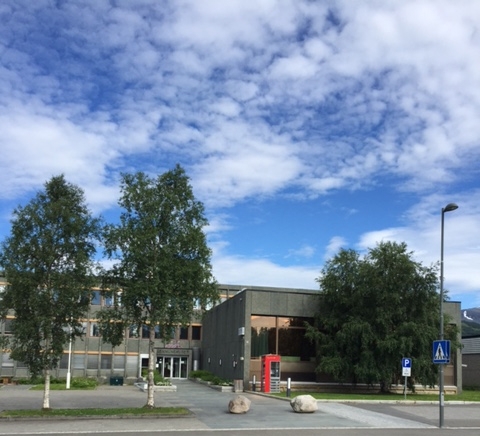 This is the story of how Norway’s most important conversation-space was designed by a young, freshly graduated man from Bergen.

“Norwegian architects are hereby invited…”
In the autumn of 1932, Oslo Telefonanlegginitiated an architectural competition. Finally, Oslo would get its own telephone booth. The city had had so called “talking-stations” from 1885, which in turn were overtaken by automatic telephones 
 only available at selected Narvesen kiosks. The state 
was of the opinion that now was the time to offer the public a better service; public telephone booths open 24/7, like the ones they already had in Sweden and England. But what would they look like, these new telephone booths? What considerations would it
 be necessary to take when designing it? The telegraph board developed a detailed list of demands and restraints: “The booth is intended to be placed outside on the streets and squares and need to be designed so that snow and ice does not hinder the opening and closing of the doors,” they wrote. “To prevent vandalism, theft, uncleanliness etc. inside the booth, it needs to be designed so that from all angles one may see what is going on in there.” Additionally, it would need to withstand storms and bad weather, and “preferably also being whipped by rain mixed with seawater” 

This was not all: The appearance would have to be «pleasing». The booth also needed to be movable, so that it could be taken in to be serviced at Telegrafverket’s main workshops. The reqired material was iron, and the surface was to be spray painted  preferably using car-body paint. There was a requirement for “a writing shelf, a pack shelf, and a suitable place for the telephone catalogue.” Also, there would need to be an illuminated TELEFON  sign, easily visible from all four angles. The total cost for each booth should not exceed 1000 kroner. The first prize for coming up with such a product was 800 kroner.

“Norwegianarchitects are hereby invited to partake in a competition for the design of a telephone booth…”  

The man with the solution
«At some point in 1932, Georg Fredrik sat at a party in Bergen. Maybe he felt a bit lost and forgotten as he often had throughout his life. He retreated to a quiet corner, took out a pencil and strted doodling on a matchbox.  According to my mother, this was how the telephone booth came into being.” In the book “Norges lille røde  historien om telefonkiosken,” Lars Fasting describes his father, the man who is far less known than the iconic architctural structure he left behind. Georg Fredrik Fasting was from Bergen, born into a family of working people and smallholders. One unusual facet of Georg Fredrik was that he was born without ears. His mother made sure he learnt to speak, read and write, 
ut Lars Fasting indicates that his father would seek refuge in drawing when the social challenges became too much to bear. And in the end drawing became his profession. In 1924 he secured a guarantor for a student loan, and started studying to become an a
rchitect at the NTH. Throughout the 1930s he entered several architectural competitions, with drafts produced, according to his son, “after work and in the late hours of the night.”

His efforts were not wasted. Out of 93 entries, with names such as “Flirt”, “Brrr”, “Ring” and “Amor”, the jury selected Fasting’s submission, “RIKS” as the new telephone booth: “The draft shows a strikingly simple solution to the task, technically as well as aesthetically well worked out.”

Taut and provident
Simple and aesthetc are the keywords here. Fasting had designed a booth pointing towards the future, and to modernism. Just how modern it was can be seen by comparing RIKS to the British telephone booth, also designed in the interwar-era. While the British version with it classicistic style is looking back to the heyday of the empire, Fasting’s booth is progressive and functionalistic. Like most Norwegian architects, Fasting broke with the classicistic style of architecture after the Stockholm-exhibition in 1930. “After it, almost all buildings erected in Norway until the German invasion in 1940, were in the functionalistic architectural style,” writes senior curator of architecture at the Norwegian National Museum, Ulf Grønvold, in the book, “Den lille røde”.“TheNorwegian booth is a piece of functionalistic architecture, an asymmetric composition with its roof slab overhanging the word TELEFON, in bold sans seraph lettering,”concludes Ulf Grønvold.

Fashionably red
And it was red. Fasting chose a colour which was part of the modern palette. “A bright red colour, but not as shiny as a signal red, the character of the colour places it among the fashionable colours within functionalism,” states paintings conservator and researcher in NIKU (Norwegian Institute for Cultural Heitage Research), Jon Brænne. In his opinion, Fasting went for visibility without making the booth stand out too much from its surroundings. The original colour was in use up to around 1950, when it changed to signal red. Towards the end of the 1970s the clour was again adjusted towards today’s orangey red.

The design, however, has not changed. RIKS is eighty years and still looks remarkably good. That’s what makes Fasting’s telephone booth a classic  even before it was added to DOCOMOMO’s list over moden icons of design. For Telenor, the telephone booth has served as a pathway into the hearts of the public. For many, Telenor (Televerket) was synonymous with exactly this telephone booth, because this was where one would go to place a call. Having a home
phone was not common until the 1980s. As such the red box became part of the Norwegian everyday and consciousness. The symbol- and publicity value of this is hard to evaluate, but in 2007 it was time to give honour where honour was due, Telenor, in consul
tation with the Directorate for Cultural Heritage, decided to preserve 100 telephone booths for all eternity.

And what about Georg Fredrik Fasting? What happened to him? At the age of 56 an entry in his diary states: «I CAN HEAR». As the first person in th world he had undergone an operation where he had ear canals constructed and eardrums fitted. For the rest of his life, the man behind Norway’s own telephone booth could answer the telephone himself.

Source: Norges lille røde historien om telefonkiosken (2007), issued by The Norwegian Telecom Museum and Telenor Cultural Heritage.