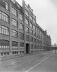 Femvånings fabriksbyggnad i rött tegel, AB Marks skofabrik, A.P. Hallkvist.
Nyuppförd fabriksbyggnad åt AB Marks Skofabrik. Inflyttningen skedde i januari 1917. Byggnaden ritades av Wilh. Renhult och uppfördes av Byggfirma P. Eriksson på uppdrag av AB A.P. Hallqvist.