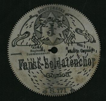 Perforterte metalplater med pigger på undersiden. Programmert musikk for platespilledåse.
30-spor, Ø 11.5 cm (4 1/2').
Drivsystem: Sentrumshull med tunge (4mm lang) samt tagger (2 mm lange) perifert langs kant, som et tannhjul. 
U-formet pigger på undersiden av platene.

Sentrumhull, diameter: 7,8 mm
Avstand mellom 10 spor: 13 (mm, ca)
Avstand sentrumsaksling – første spor:  14,5 mm
Total bredde spor:  37,3 mm

Platene er for øvrig kompatibel med Symphonion Simplex (30-spor, Ø 11.5 cm)