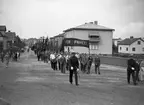 Ett demonstrationståg med avslutande möte i Mariebergsskogen hölls till stöd för regeringssidan i spanska inbördeskriget år 1937. Baneret är retuscherat.