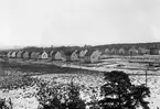 Vy över södra Romstad 1939. I bakgrunden skymtar gasklockan och vattentornet på Kvarnberget och till höger folkskolelärarseminariet vid Hööksgatan.