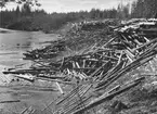 Timmerupplag för vårflottning. Testeboån, Åmotsbruk.