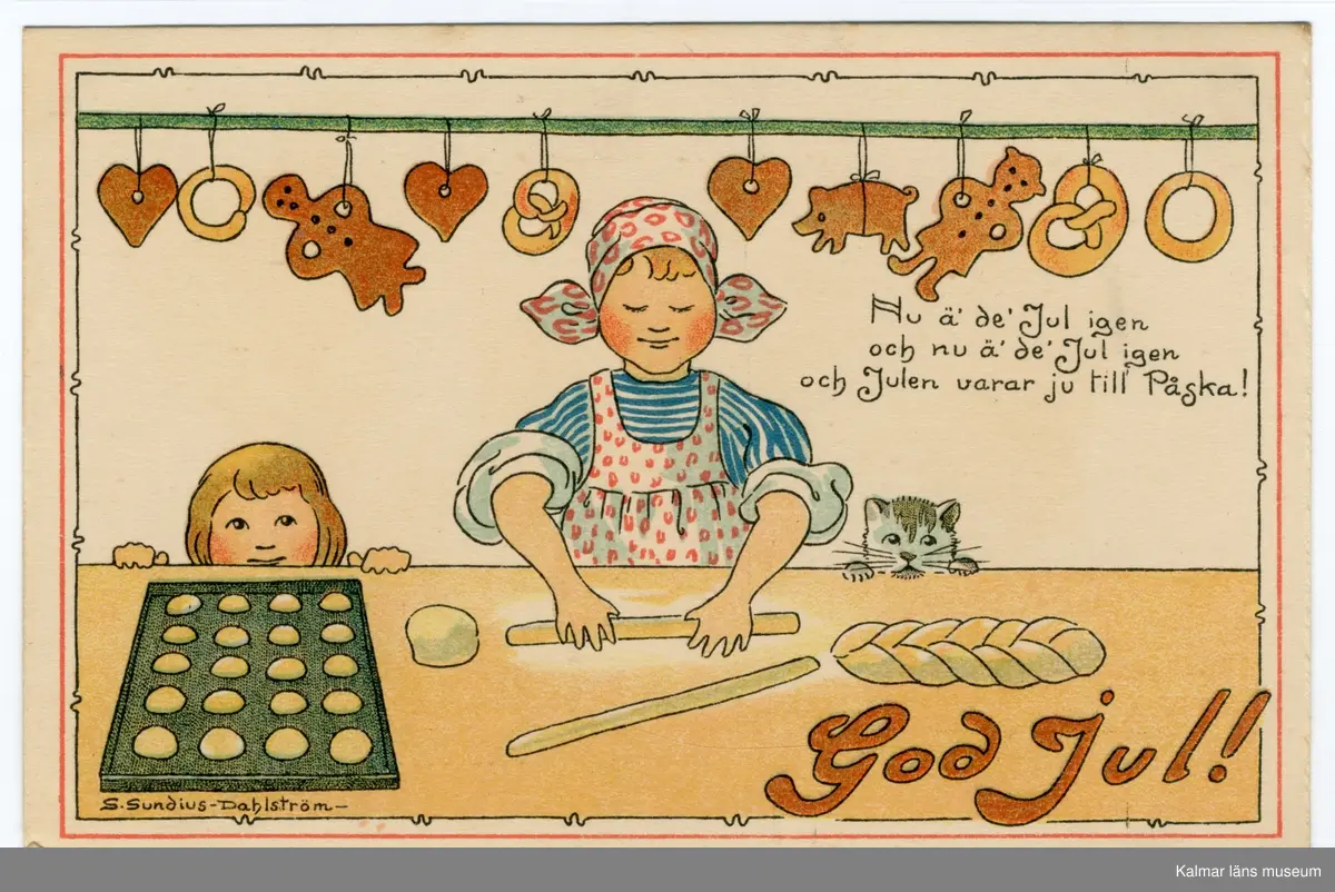 En kvinna står vid ett bord eller en bänk och bakar, hon rullar en deg till en längd. Bredvid henne till höger tittar en katt upp och till vänster tittar ett barn upp över bordskanten. På bordet ligger en plåt med bullar, deg och en vetelängd. Ovanför henne hänger pepparkakor och kringlor fastknutna på en stång.