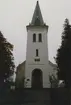 Dalhems kyrka, gaveln med kyrktorn och fönster. Foto från renoveringen 1993.