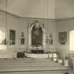 Altartavlan av S.G. Lindblom 1852, i Loftahammar kyrka.
Till vänster en äldre altartavla av M. Nicander 1787. Till höger en  tavla av Magnus Lindahl 1864.