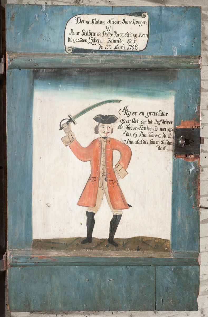 Dør,dekorert, bemalt. Grenader. "Jon Syversen og Anne Gulbrandsdatter hadde bekostet bemalingen og at de kom til Løken i Romedal 30.mars 1768.