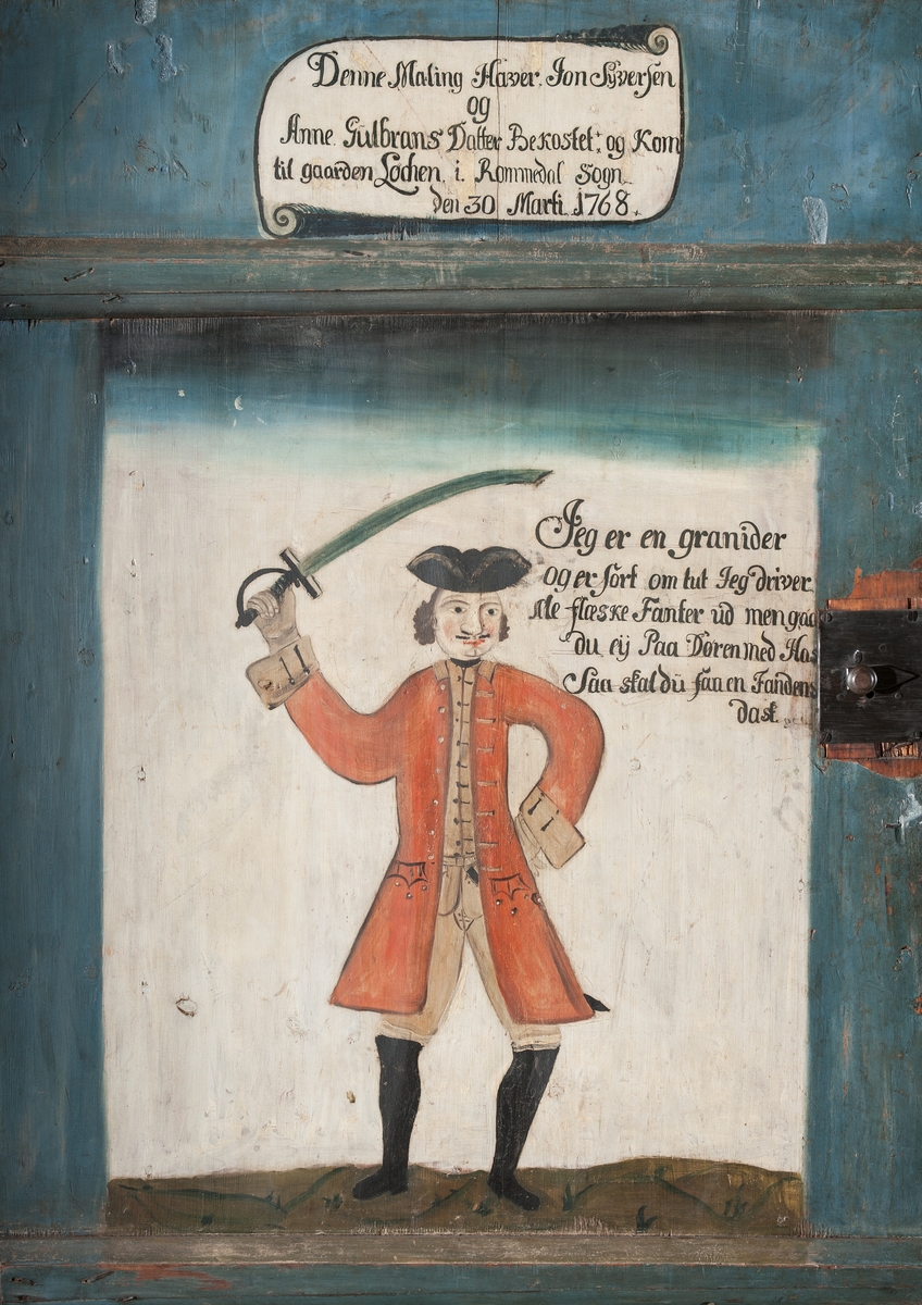 Dør,dekorert, bemalt. Grenader. "Jon Syversen og Anne Gulbrandsdatter hadde bekostet bemalingen og at de kom til Løken i Romedal 30.mars 1768.