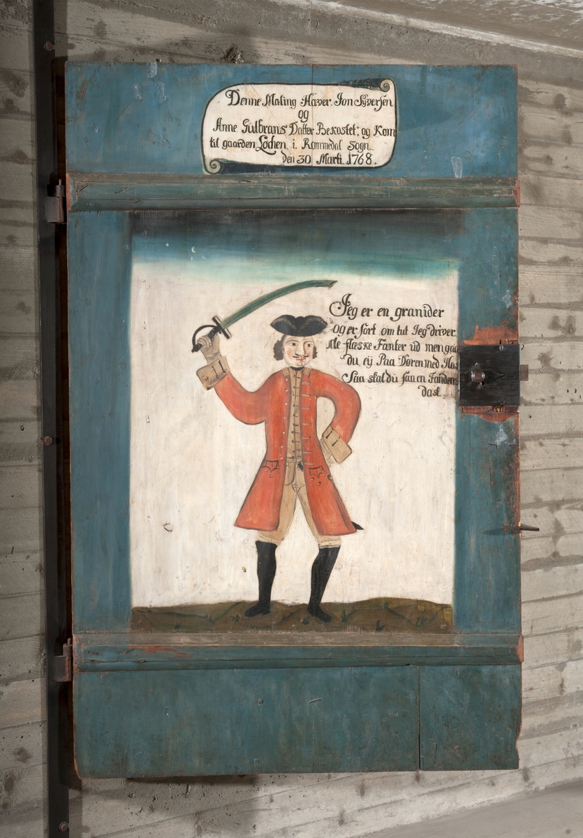 Dør,dekorert, bemalt. Grenader. "Jon Syversen og Anne Gulbrandsdatter hadde bekostet bemalingen og at de kom til Løken i Romedal 30.mars 1768.