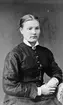 Kristina Persdotter lät fotografera sig när hon hade träffat sin förste blivande make, Jonas Björk från Arbrå och för att glädja honom.
Fotot kan i så fall vara taget någon gång under 1874 -1875.