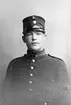 Kopia. Karl Arvid Tigerstrand, Wåle, född i Woxna 1889, död i Åsarna 1978. Orginalfotot togs c:a 1910 hos Gustaf Reimers, dit han återvände 1916 för att få en kopia. Tigerstrand tjänstgjorde vid 3:e kompaniet vilket är det nummer som finns på hans mössa.