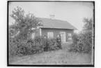 Byggnad, 2 personer. 
Lars Persson