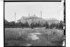 Örebro Kexfabrik AB, tvåvånings fabriksbyggnad i tegel.