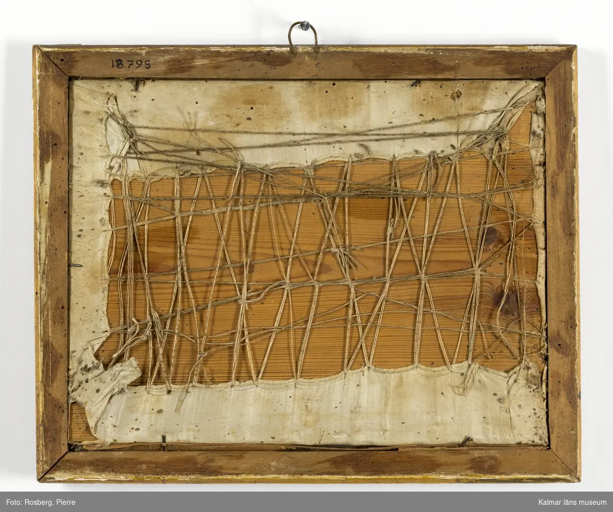 Landskap med figurscen, Amor och Psyke. Psyke har tagit Amors pilar och pilbåge, Amor till vänster i motivet.