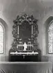 En altartavla i Åby kyrka.