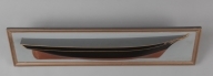 Halvmodell av skip bygget av skipsbyggmester Ananias Dekke (1832-1892). Modellen har i sin tid vært forært til brukseier P. Arnold Hansen, 1922 av Kristian S. Dekke (se baksiden av modellen). Gave til verksmester Taavig Horten (?) fra P. Arnold Hansen januar 1926. Gallionsfigur er en dame med oppsatt hår.