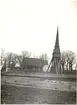 Pelarne kyrka med klockstapel.