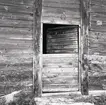 Tvådelad dörr på en byggnad på Hagelstad nr. 6.