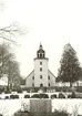Vinterbild på Odensvi kyrka och kyrkogård.