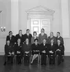 Socialdemokratiska stadsfullmäktigegruppen i Skara, 1967-1970.
Stående från vänster:
Åke Blomqvist, Evald Nordström, 
Mats Eriksson, Ester Carlsson, Leif Nordh, 
Nils Österlund, Evert Berg. 
Sittande från vänster:
Sten Ehn, K.G. Antonsson, Anders Persson, Eva Åsbrink, Erik Hjelm, Arvid Andersson, Lennart Lindén.