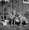 Christian, släkt till Nils Dahlman. 
Hunden heter Kelly av rasen boxer.
1950-talet.