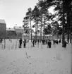 Skridskoåkning och hockeyspel på Kristinaplan, Gävle, 1957.