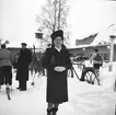Kvinna med pälsmössa.