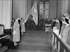 Karlsborg, armelottakårens 25-års jubileum i Garnisonskyrkan år 1959. Fanbärare Astrid Ragnar. Freijds foto.