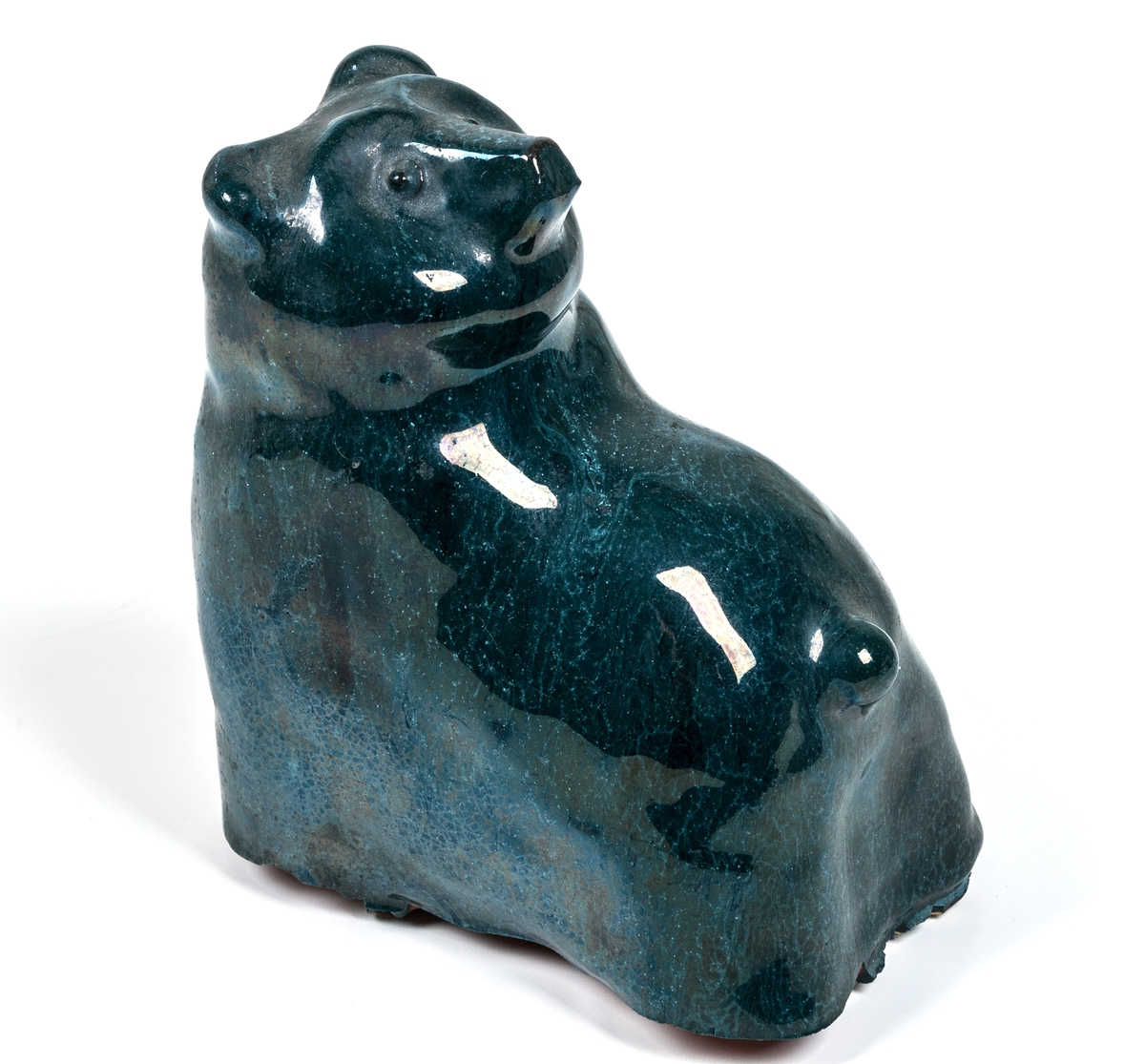 Bokstöd i form av en sittande björn, blå glasyr, lergods, formgiven av Märta Willborg, 1930-talet.