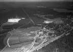 Flygfoto över Vaggeryds massafabrik i Vaggeryds kommun, Nr. H. 1909