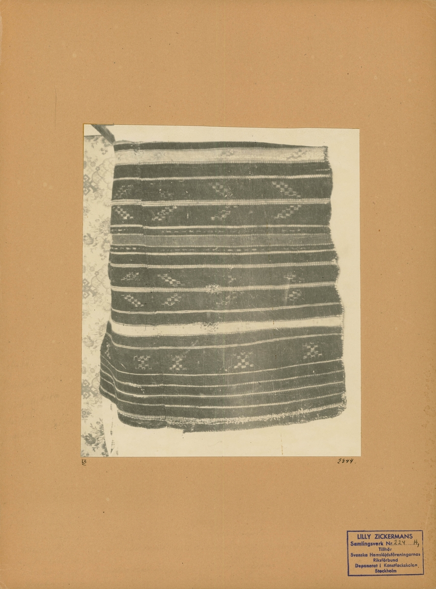 Fragment av täcke.