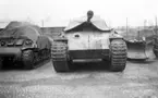 Från vänster en amerikansk stridsvagn Sherman i mitten en tysk Panter och till höger en svensk bandtraktor uppställda på garageområdet vid P 4 Skövde 1948.