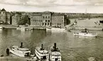 Gustavsbergsbåtar förtöjda vid Skeppsbron i Stockholm.