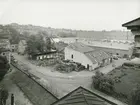 Exteriör. Vintervy över Gustavsbergs fabriksområde. Bilden tagen från Tornhusets tak. Gula byggningen t.v. och museet mitt i fonden. Slamhuset i bakgrunden och Kvarnberget i bildens bakre del t.v.