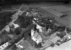 Flygfoto över kyrkan och stationen
Stationen anlades 1878. Tvåvånings stationsbyggnad i trä .Station öppnad september 1878