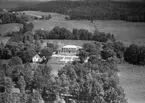 Flygfoto över Odensjö gård i Odensjö vid Barnapasjön, Jönköpings kommun. Nr H1918.