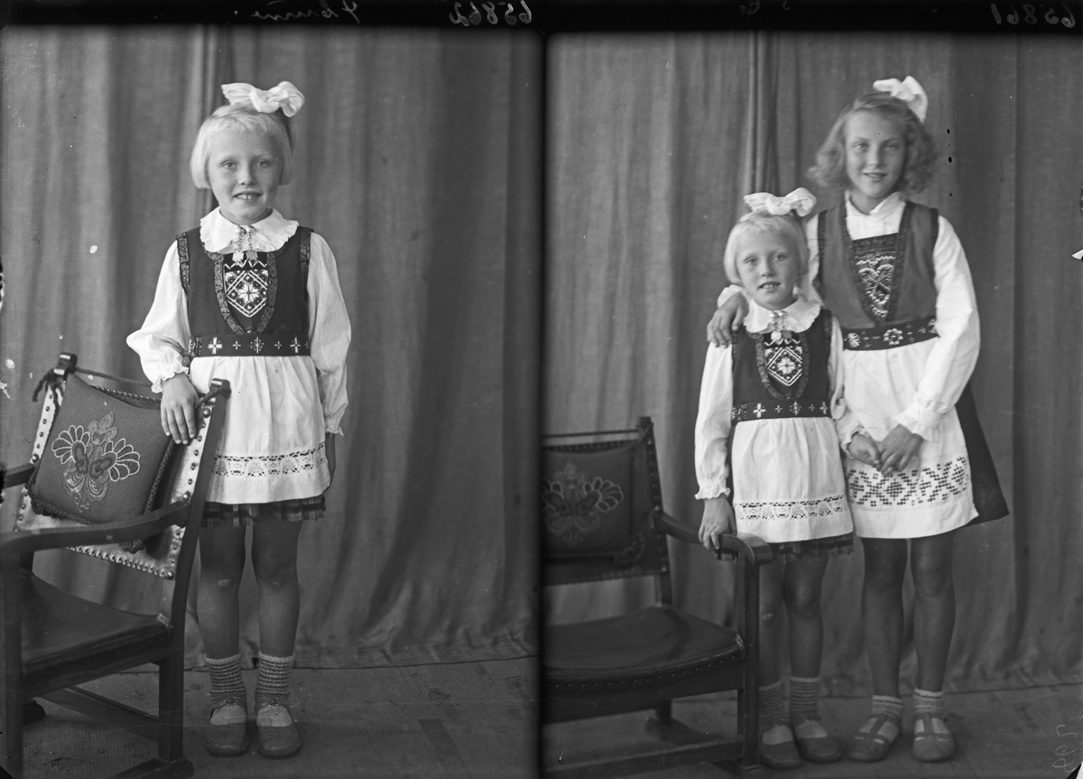 Gruppebilde. Familiegruppe på to. To unge piker i nasjonaldrakt med sløyfer i håret. Søstre. Bestilt av Erling Nilsen. Strangt. 181