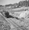 Dubbelspårsbygget Mölnbo - Björnlunda, troligen nära Mölnbo. Arbetare med tryckluftsborrar, décauvillespår med tippvagn för stentransport.
SJ Dk 566. Dk  loktyp med ny starkare motor, tillverkades  av ASEA och levererades från 1936. Högsta hastighet 100 km/h.