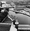 Stockholm Central sedd från Stadshusets torn. Överst i bild skymtar Norra Bantorgets stationshus. Bron närmast i bild är Stadsbron, där bortom Klarabergsviadukten, och i bildens övre del syns Kungsbron.