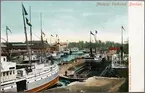 Handkolorerat vykort, med Motala Verkstads docka vid Göta Kanal som motiv.