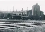 Karlskrona - Växjö Järnväg öppnades för allmän trafik 1874. Samma år färdigbyggdes stationshus i två våningar. Bangården utformades så att denna hade plats för fem spår.
Det första provisoriska lokstallet byggdes redan 1872 norr om Karlskrona station. Nytt lokstall byggdes samtidigt med bangården 1874 helt av tegel och inrymmande 6 stallplatser.