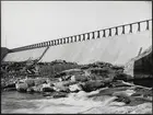 Porjus kraftverk i Stora Luleälv under byggnation. Panorama nedströms av stora skibordet.