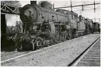 Ånglok på bangård. Ort okänd.