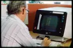 Personal vid IBM-dator.