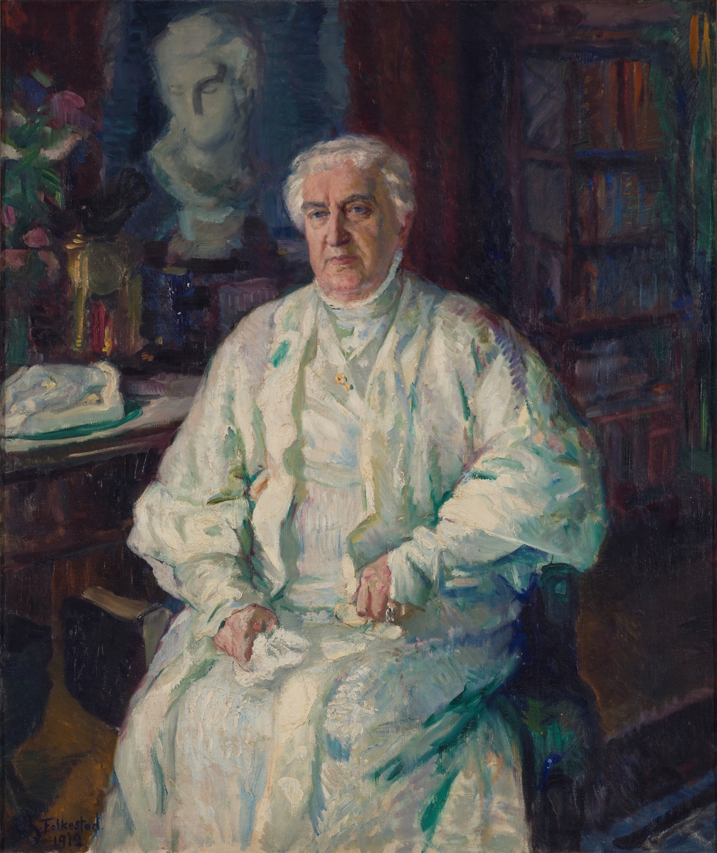 Portrettmaleri av Karoline Bjørnson. Karoline sitter ved et skrivebord som er antatt til å være på Aulestad.
