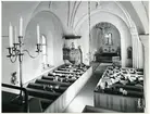 Badelunda sn, kyrkan.
Interiör med pågående gudstjänst, 1983.